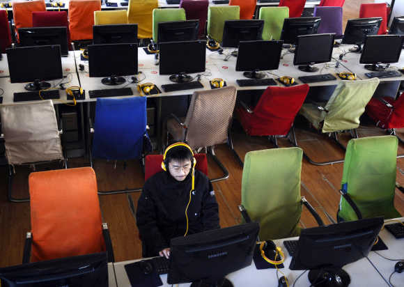 A customer uses a computer at an internet cafe at Changzhi, China.
