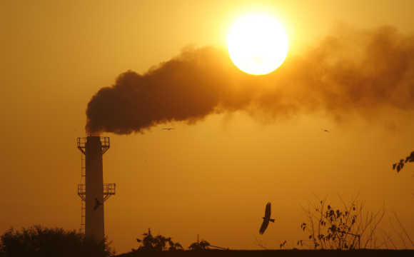 Smoke rises from chimney of a garbage processing plant on the outskirts of Chandigarh.