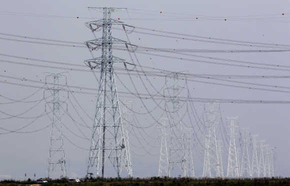 Transmission towers carrying solar and thermoelectric power from the Korea South East Power Co. plant are seen in Ansan, South Korea.