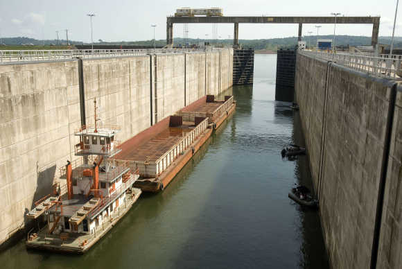 A cargo barge enters a lock of the Tucurui dam on the Tocantins River, Brazil.