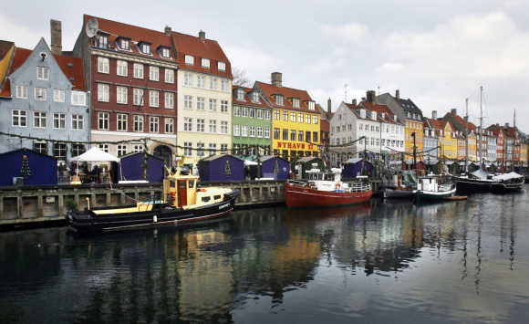 Boats are seen anchored at the 17th century Nyhavn district, home to many shops and restaurants in Copenhagen.