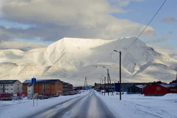Town of Longyearbyen with the Hiortfjellet mountain in the background is seen in winter light in Svalbard, Norway.