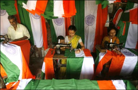 Workers stitch Indian national flags at a workshop in Siliguri.