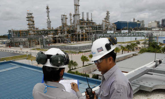Technicians work at a Thailand's PTT Chemical complex at the Map Ta Phut industrial estate in Rayong.