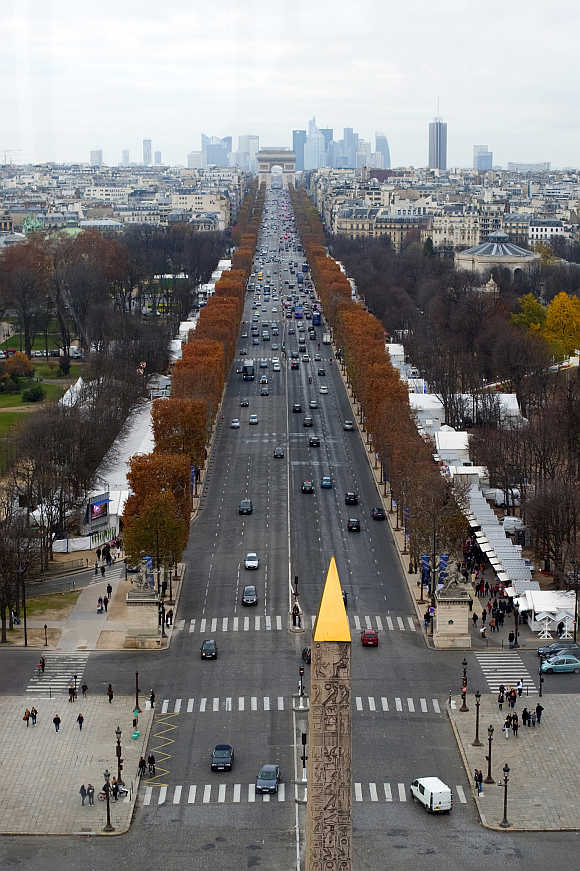 A view of the Concorde obelisk, Champs Elysees Avenue and the Arc de Triomphe monument in Paris.
