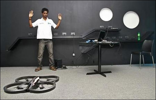 Vivek, an engineering student, demonstrates as he tries to control a Quad-copter with his hand at the Startup Village.