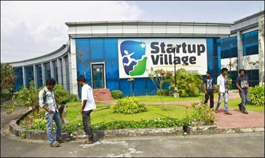 Employees stand outside the Startup Village.