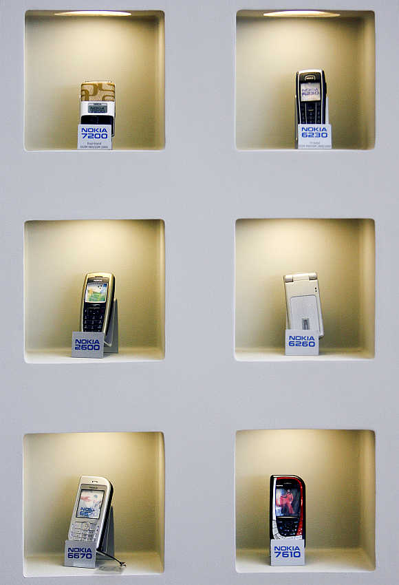 A selection of mobile phone models are displayed at Nokia's headquarters in Helsinki.