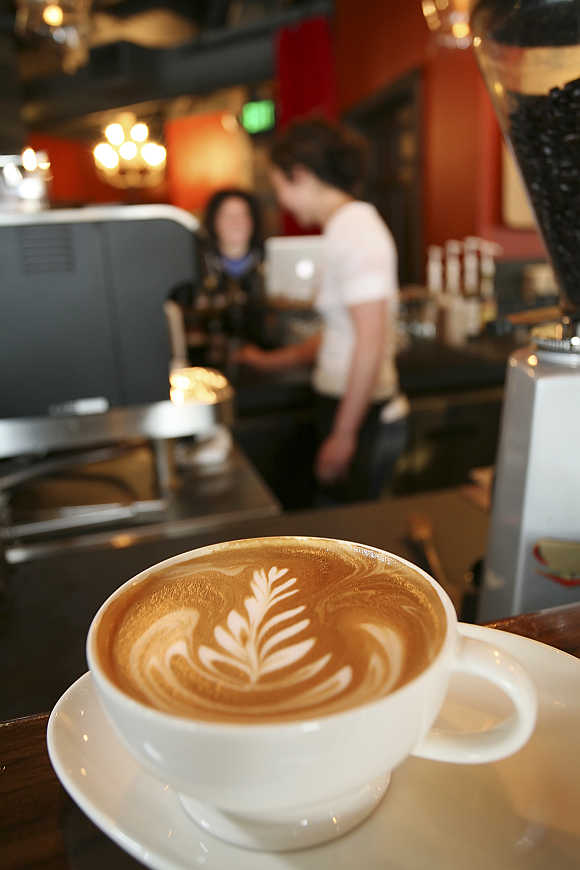 An artfully poured latte rests on the counter at Starbucks' Roy Street Coffee and Tea in Seattle, Washington.