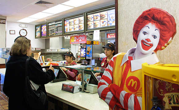 A patron picks up an order at a McDonald's restaurant in Washington.