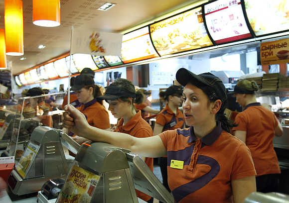 Service staff attend to customers at a McDonald's restaurant in Moscow.