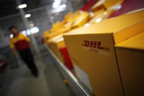 An employee is seen next to his workstation during an operational test of the new DHL North Asia Hub