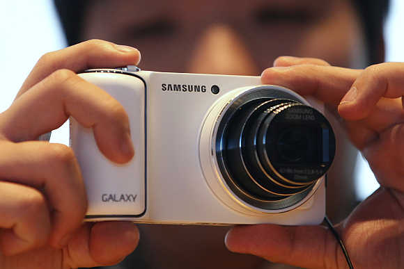 A visitor tries out Samsung Electronics' Galaxy Camera in Seoul.