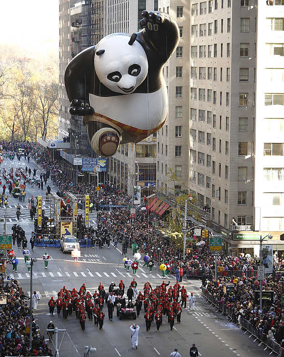 A Kung Fu Panda balloon float makes its way down Sixth Avenue during the Macy's Thanksgiving Day Parade in New York.