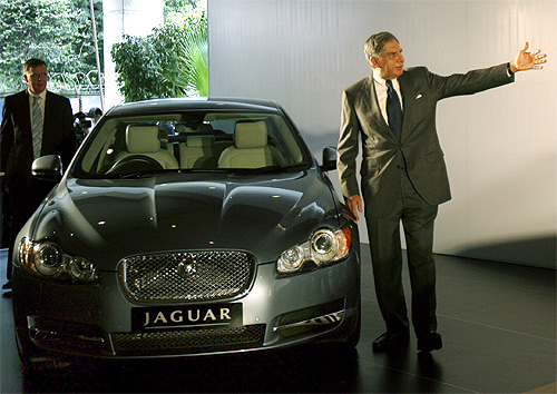 Ratan Tata stands next to a Jaguar XF in Mumbai.