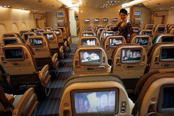 A stewardess in the Economy-Class cabin at Singapore's Changi Airport.