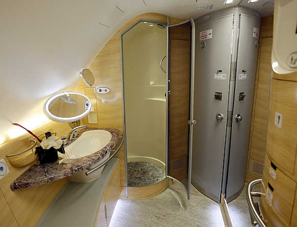 The bathroom with a shower stall for First-Class passengers inside Emirates' Airbus A380.