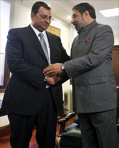 India's Trade Minister Anand Sharma (R) shakes hands with Tata Sons Deputy Chairman Cyrus Mistry before the start of their meeting in New Delhi.