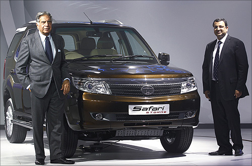 Tata Group Ratan Tata (L) and Tata Sons Deputy Chairman Cyrus Mistry pose with company's new SUV Safari-Storme during India's Auto Expo, in New Delhi.