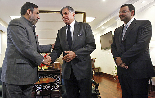 Trade Minister Anand Sharma (left) shakes hands with Ratan Tata as Cyrus Mistry looks on.