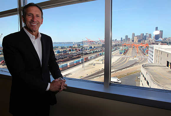 Starbucks CEO Howard Schultz stands in his office at his company's corporate headquarters in Seattle, Washington.