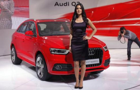 Bollywood actress Katrina Kaif poses with Audi's new SUV Q3 car during the India Auto Expo in New Delhi.