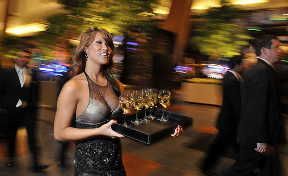 Mariann Lau serves glasses of wine in Las Vegas.