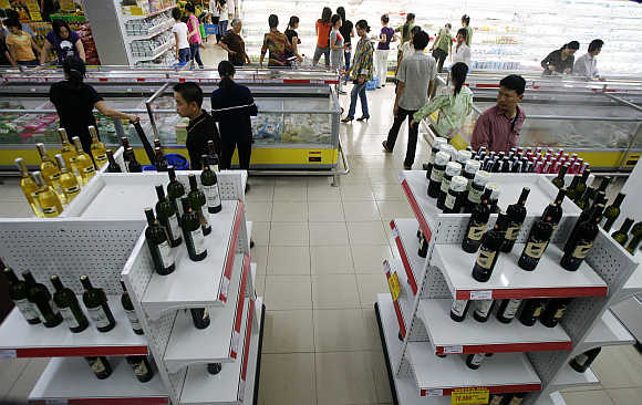 Wine bottles are displayed at a Saigon Coop supermarket in Hanoi, Vietnam.