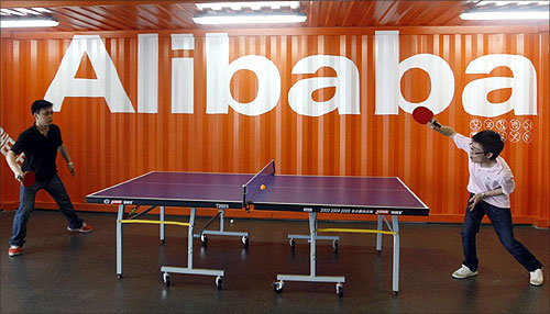 Employees play table tennis inside the headquarters office of Alibaba (China) Technology Co. Ltd on the outskirts of Hangzhou.