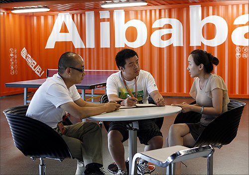 Employees hold a meeting inside the headquarters office of Alibaba (China) Technology Co. Ltd on the outskirts of Hangzhou.