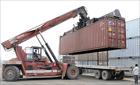A container is loaded on a trailer truck at Thar Dry Port in Sanand.