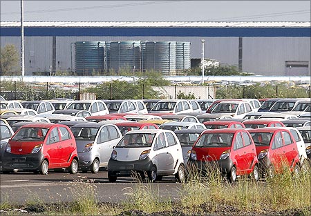Tata Nano automobiles are seen parked at the carmaker's plant in Sanand.