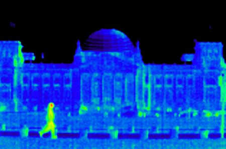 A pedestrian passes the Reichstag building.