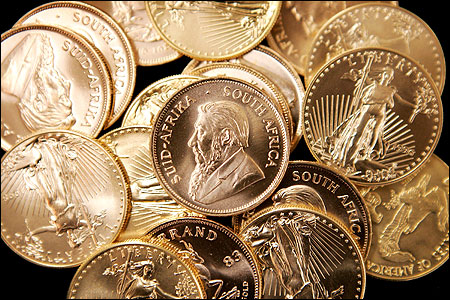 American Eagle and South African Krugerrand gold bullion is offered for sale at the Chicago Coin Company.