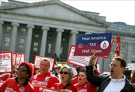 Protesters call on the Obama administration and the Treasury Department to tax Wall Street transactions in Washington.
