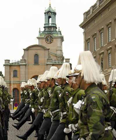 (Swedish armed forces soldiers in front of the Stockholm Cathedral in Gamla Stan, or the Old Town district of Stockholm