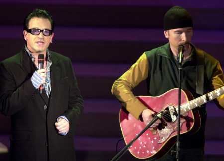 It also has a stake in music channel VH1. Rock group U2 performs on stage.