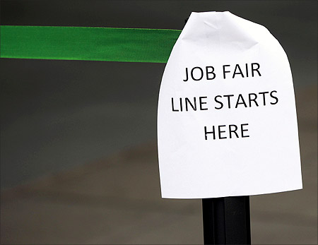 A sign marks the entrance to a job fair in New York.
