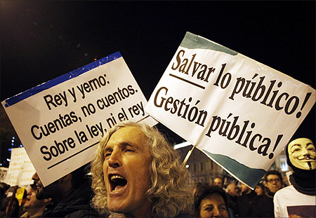Protesters take part in a march called by the Spanish indignant movement against politicians, banks, the economic crisis and high unemployment in downtown Madrid.