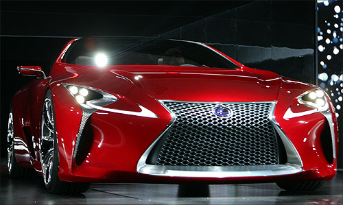 The Lexus LF-LC sports car concept is driven onto the stage.