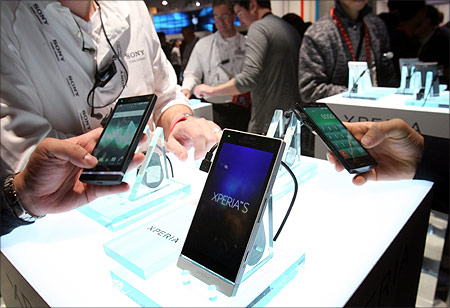 Showgoers look over Sony Experia.