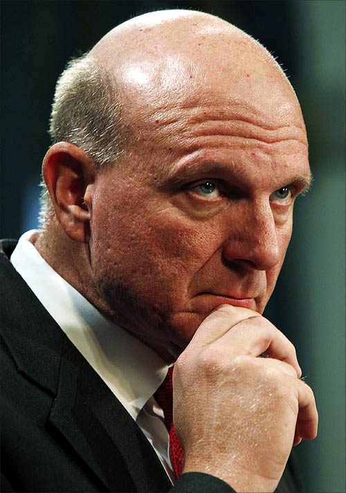Microsoft Chief Executive Officer Steve Ballmer listens to a reporter's question at a news conference.
