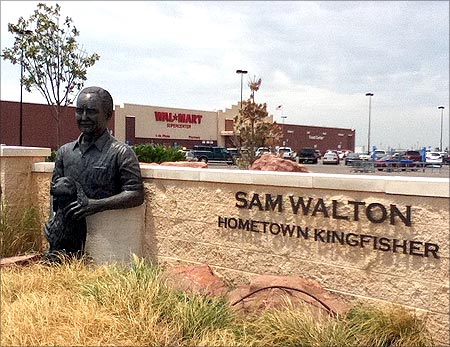 Statue of Sam Walton and his dog outside of Wal-mart in Kingfisher, Oklahoma.