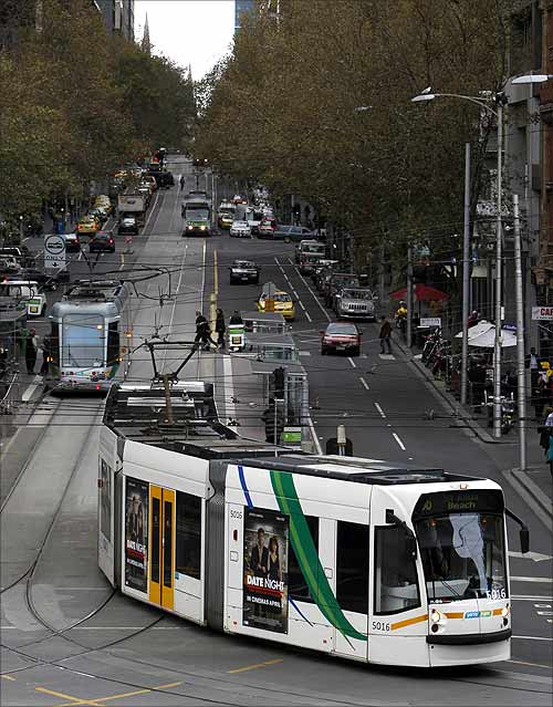 A tram travels on a road in central Melbourne.