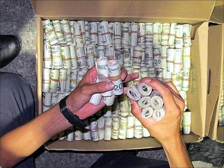 Dollars in cash are seen in this photograph released by Mexico's tax office in Mexico.