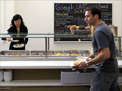 People eat in the cafeteria at the Google campus.