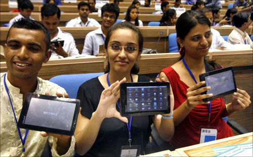 Students display Aakash, which means sky, dubbed the world's cheapest tablet computer.