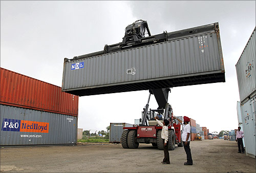 A mobile crane prepares to stack a container at Thar Dry Port in Sanand in the western Indian state of Gujarat.