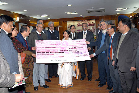 Former Railway Minister Mamata Banerjee received a dividend cheque for the year 2009-10 from the Indian Railway Finance Corporation Limited.
