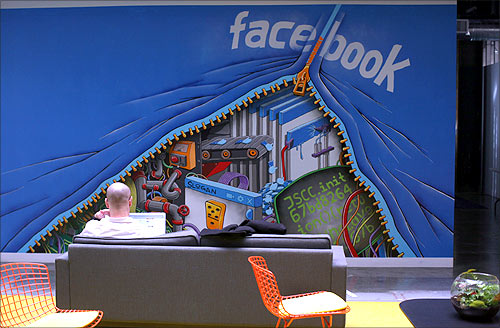 An employee works on a computer at the new headquarters of Facebook in Menlo Park, California.